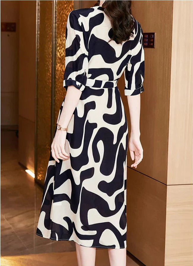 Dames Elegante jurk met abstracte print | Midi