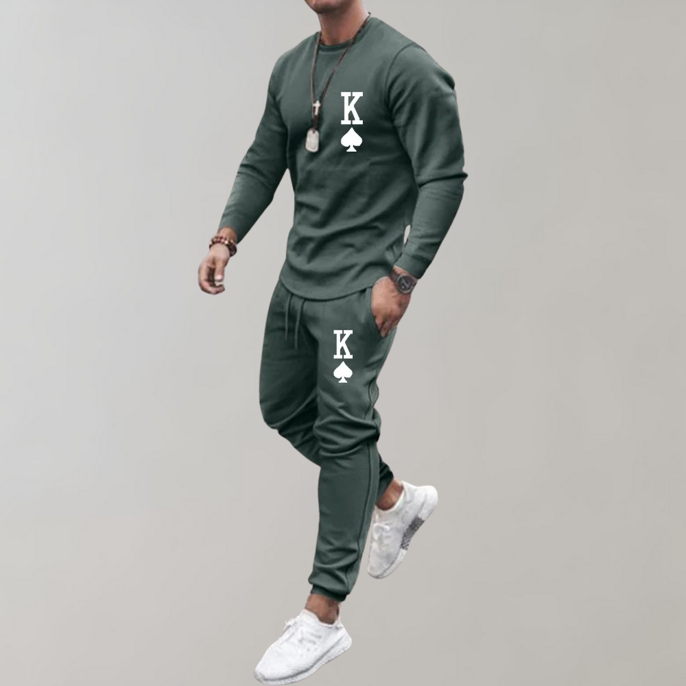Groen trainingspak voor heren met K-logo, lange mouwen en joggingbroek. Comfortabel sportkleding, ideaal voor fitness en casual dragen.